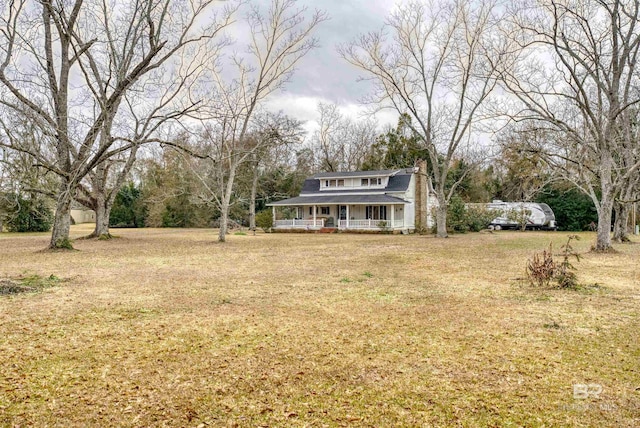 view of yard with covered porch