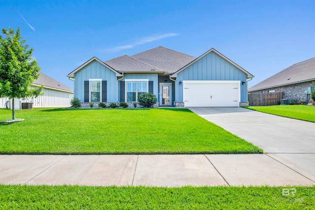 single story home featuring a front yard and a garage