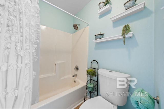 bathroom with toilet and shower / bath combo with shower curtain