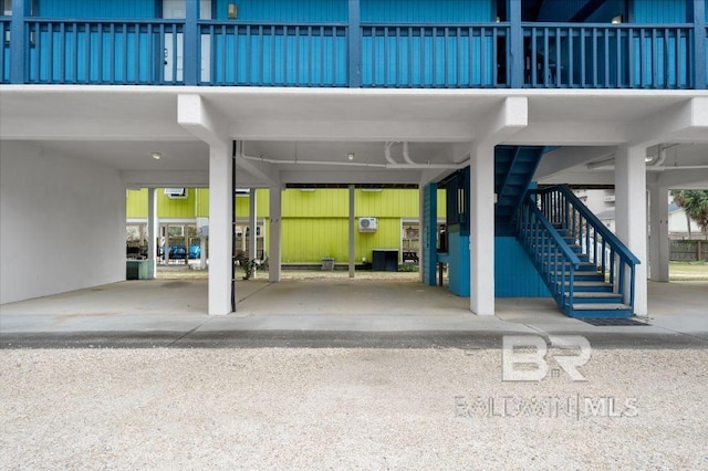 view of patio / terrace with a carport and stairs