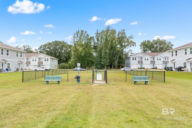 view of property's community featuring a yard