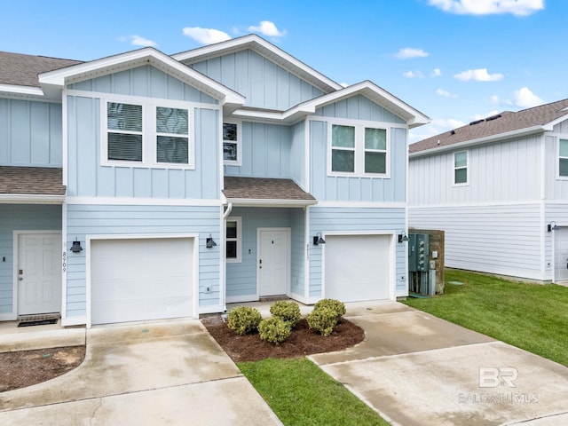 view of front of home with a garage and a front yard