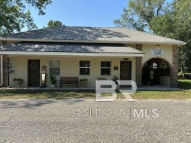 24926 Ponder Loop, Loxley, AL 36551 - view of front of home with a porch and a standing seam roof