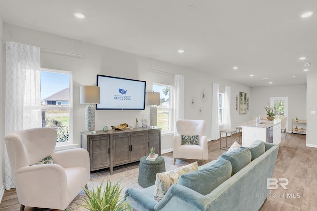 24926 Ponder Loop, Loxley, AL 36551 - living room featuring light wood finished floors, recessed lighting, and baseboards