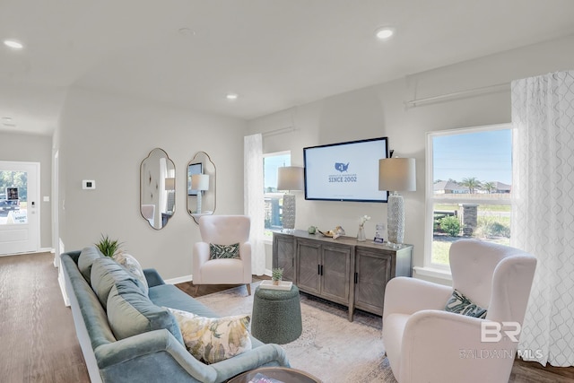 24926 Ponder Loop, Loxley, AL 36551 - living area featuring wood finished floors, healthy amount of natural light, recessed lighting, and baseboards