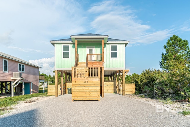 view of front of home featuring a carport and central AC