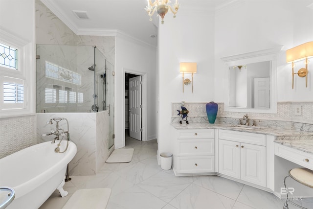 613 Wedgewood Dr, Gulf Shores, AL 36542 - bathroom with marble finish flooring, ornamental molding, vanity, a stall shower, and a soaking tub