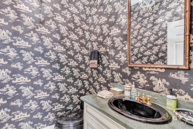 613 Wedgewood Dr, Gulf Shores, AL 36542 - bathroom with wallpapered walls and vanity