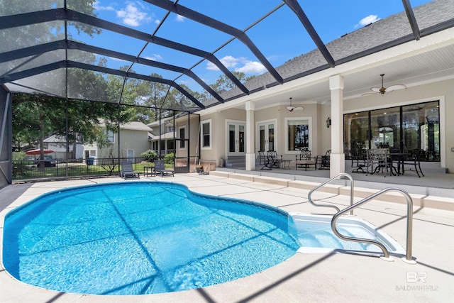 613 Wedgewood Dr, Gulf Shores, AL 36542 - view of swimming pool featuring a patio area, a ceiling fan, french doors, and glass enclosure