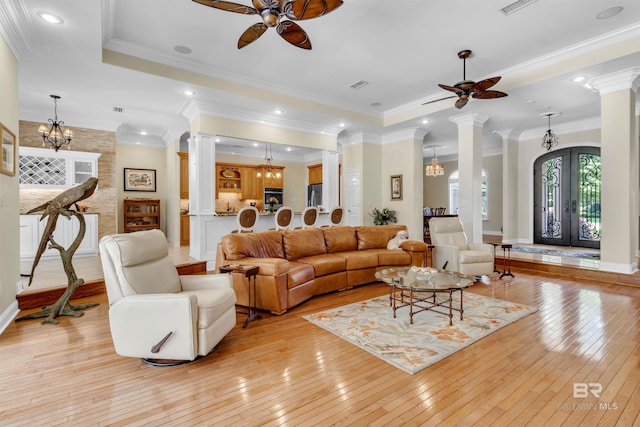 613 Wedgewood Dr, Gulf Shores, AL 36542 - living area featuring a ceiling fan, decorative columns, and crown molding