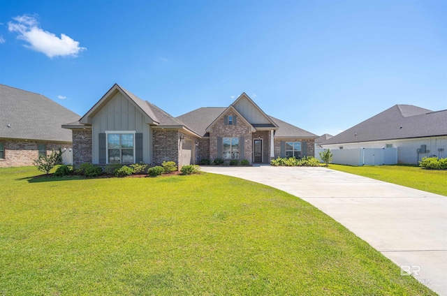 view of front of property featuring a front lawn and a garage