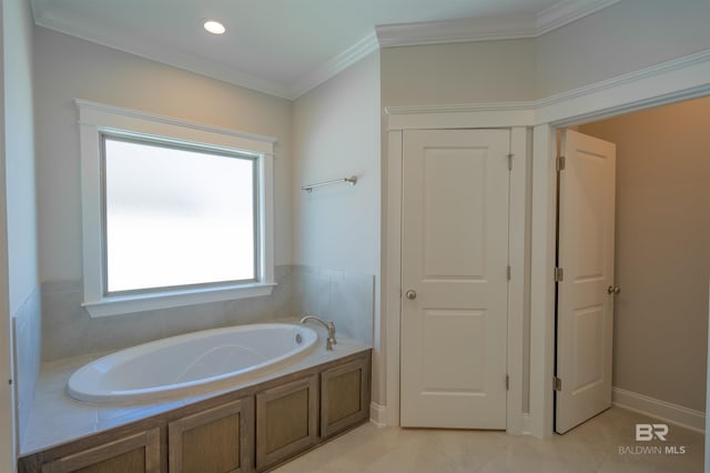 bathroom with tile patterned flooring, a bathtub, and crown molding