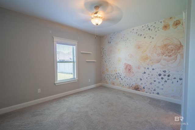 carpeted empty room with ceiling fan