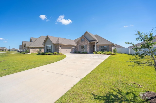 view of front of house featuring a garage and a front lawn