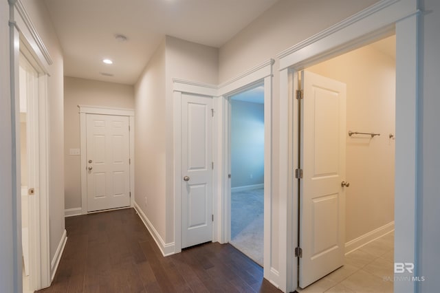 hall with hardwood / wood-style floors