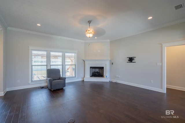 unfurnished living room with dark wood-type flooring, a brick fireplace, ceiling fan, and ornamental molding