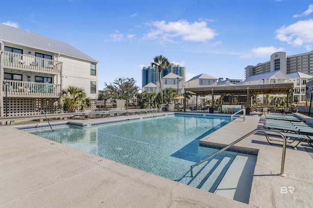 community pool with a patio area