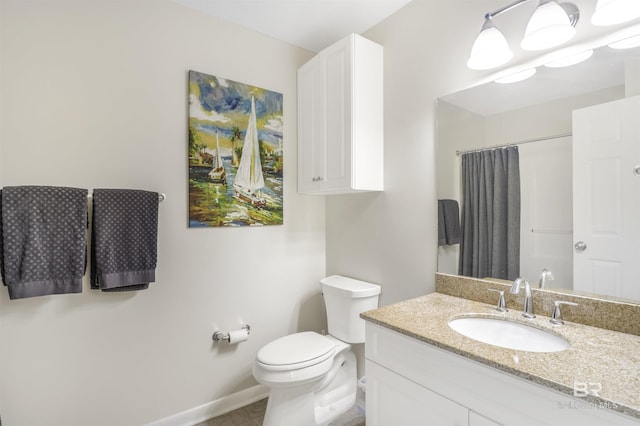 bathroom featuring baseboards, a shower with shower curtain, toilet, tile patterned flooring, and vanity