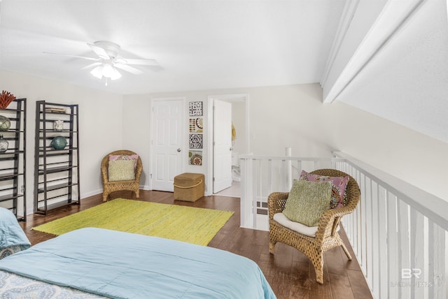 bedroom featuring vaulted ceiling with beams, baseboards, a ceiling fan, and wood finished floors