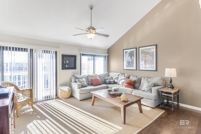 living room with ceiling fan, high vaulted ceiling, dark wood-style floors, and baseboards