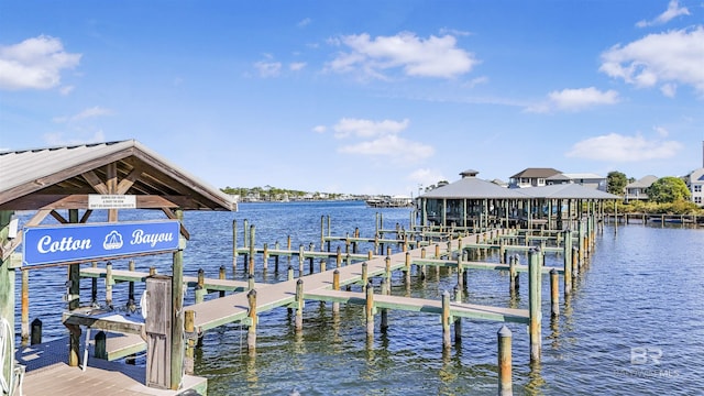 dock area with a water view and boat lift