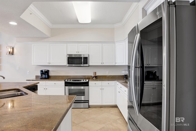 kitchen featuring crown molding, white cabinetry, stainless steel appliances, and a sink