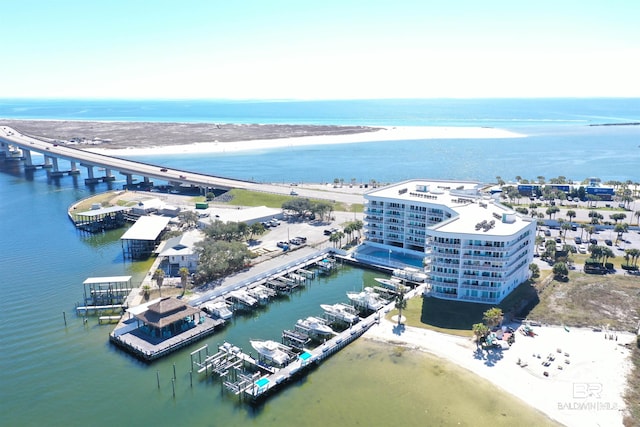 drone / aerial view featuring a beach view and a water view