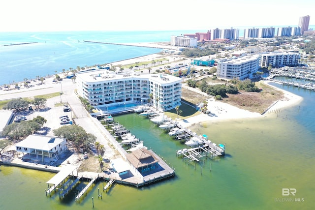 bird's eye view featuring a water view and a view of city