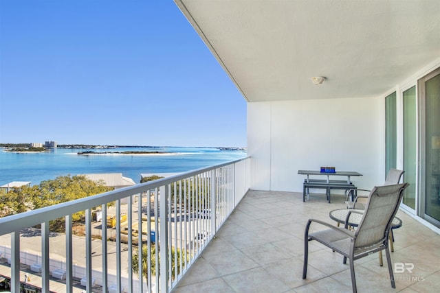 balcony featuring a water view