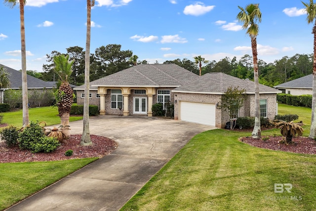 270 Cypress Lake Dr, Gulf Shores, AL 36542 - view of front of property with french doors, driveway, a front lawn, and an attached garage