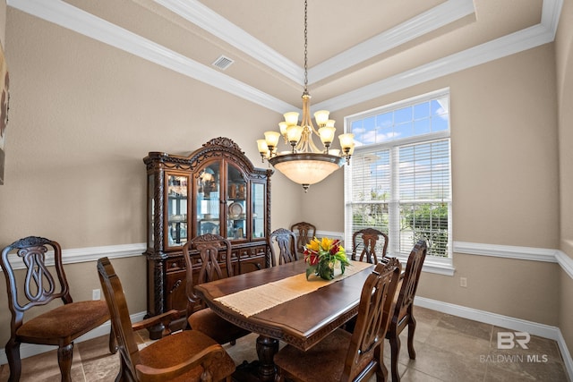 270 Cypress Lake Dr, Gulf Shores, AL 36542 - tiled dining area featuring a chandelier, ornamental molding, and a tray ceiling