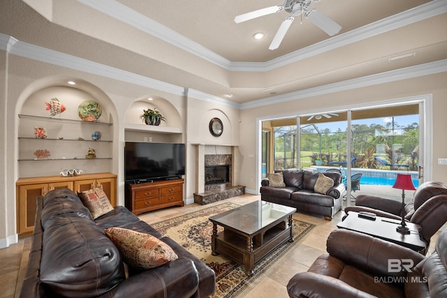 270 Cypress Lake Dr, Gulf Shores, AL 36542 - living area featuring ceiling fan, ornamental molding, built in features, a premium fireplace, and recessed lighting