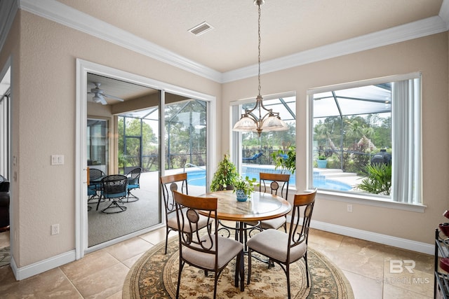 270 Cypress Lake Dr, Gulf Shores, AL 36542 - dining room with a sunroom, ornamental molding, plenty of natural light, and a ceiling fan