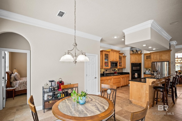 270 Cypress Lake Dr, Gulf Shores, AL 36542 - dining area with ornamental molding, recessed lighting, a chandelier, and arched walkways