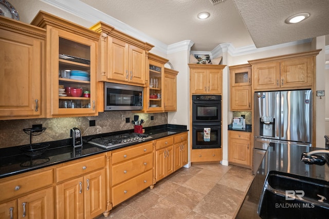 270 Cypress Lake Dr, Gulf Shores, AL 36542 - kitchen featuring stainless steel appliances, crown molding, backsplash, a textured ceiling, and glass insert cabinets