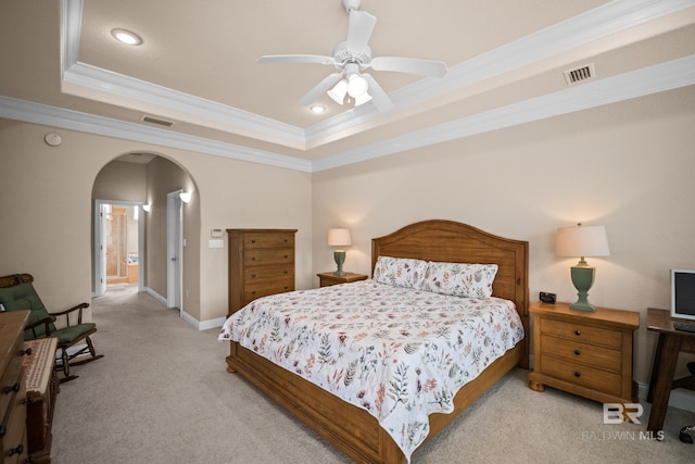 270 Cypress Lake Dr, Gulf Shores, AL 36542 - bedroom with a raised ceiling, arched walkways, ornamental molding, carpet floors, and recessed lighting