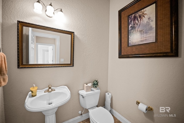 270 Cypress Lake Dr, Gulf Shores, AL 36542 - bathroom featuring toilet and baseboards
