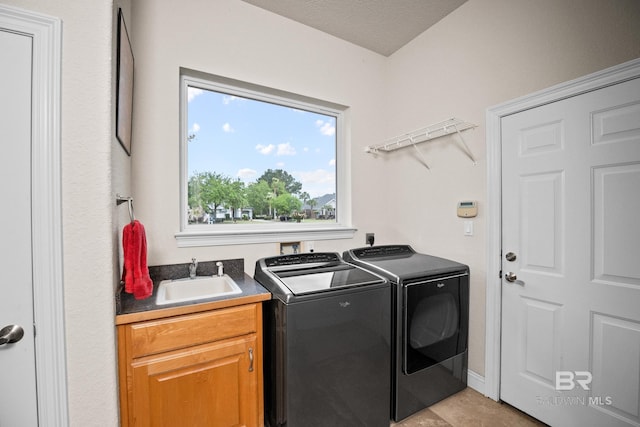 270 Cypress Lake Dr, Gulf Shores, AL 36542 - laundry room featuring washing machine and dryer and cabinet space