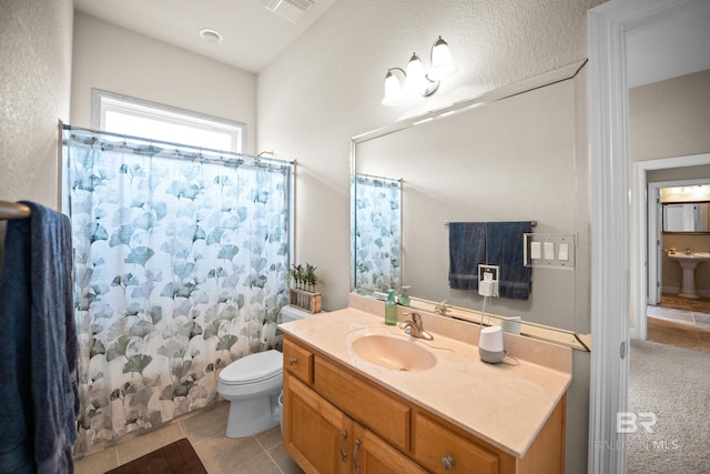 270 Cypress Lake Dr, Gulf Shores, AL 36542 - full bath featuring vanity, tile patterned flooring, and a shower with shower curtain