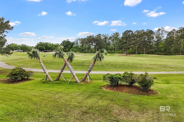270 Cypress Lake Dr, Gulf Shores, AL 36542 - view of property's community featuring a lawn, view of golf course, and view of wooded area