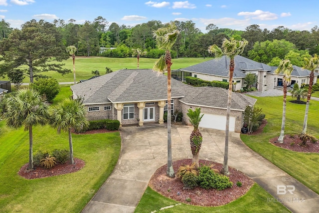 270 Cypress Lake Dr, Gulf Shores, AL 36542 - view of front of home featuring concrete driveway, a garage, a front yard, and french doors