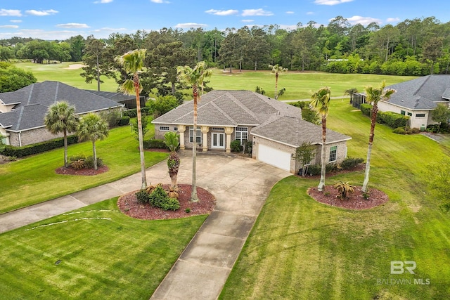 270 Cypress Lake Dr, Gulf Shores, AL 36542 - view of front facade with concrete driveway, a garage, and a front lawn