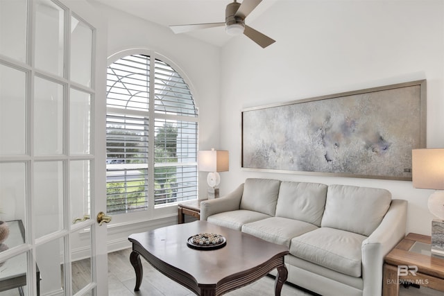 living room featuring light hardwood / wood-style floors and ceiling fan