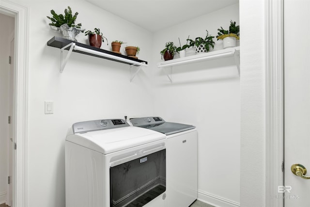 washroom with independent washer and dryer