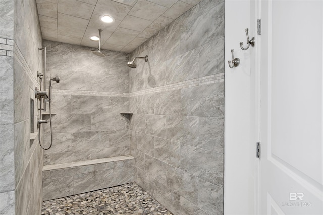 bathroom featuring tiled shower