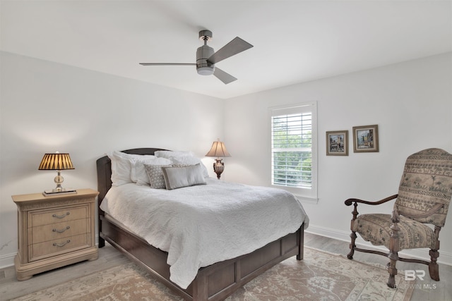 bedroom featuring ceiling fan and light hardwood / wood-style flooring