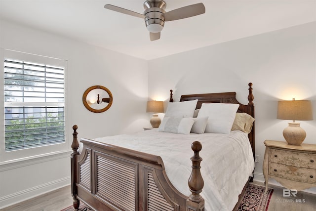 bedroom featuring ceiling fan and hardwood / wood-style floors