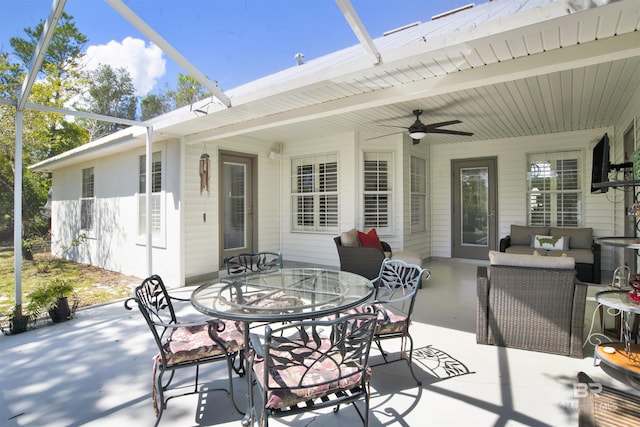 view of patio / terrace with a lanai and ceiling fan