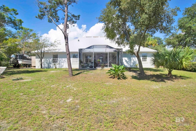 view of yard with glass enclosure