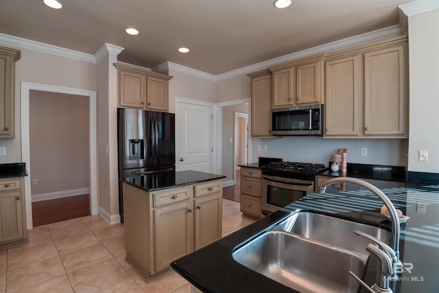 kitchen featuring a center island, sink, ornamental molding, and stainless steel appliances